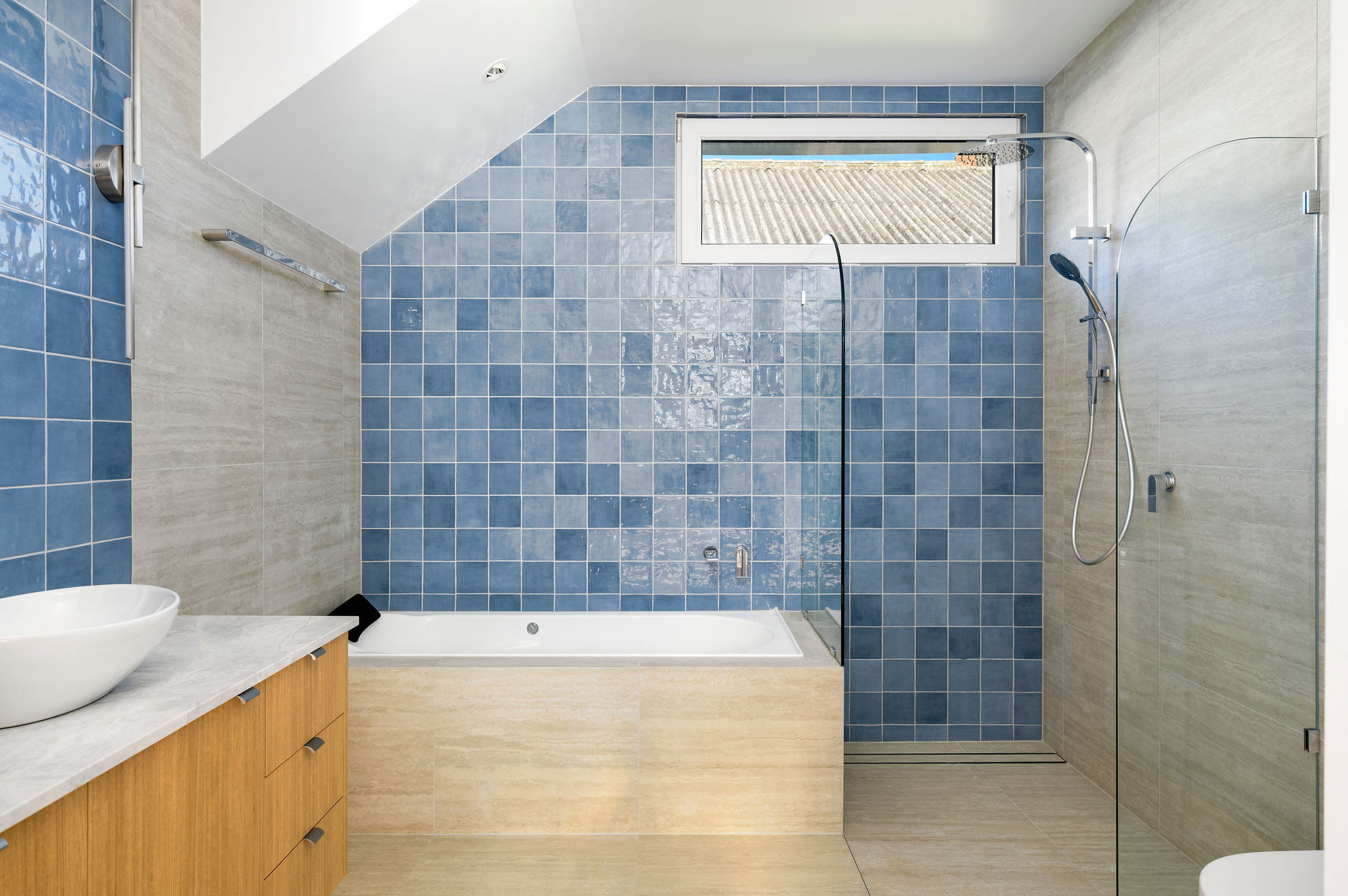 Stockton House bathroom with tiled walls and natural light